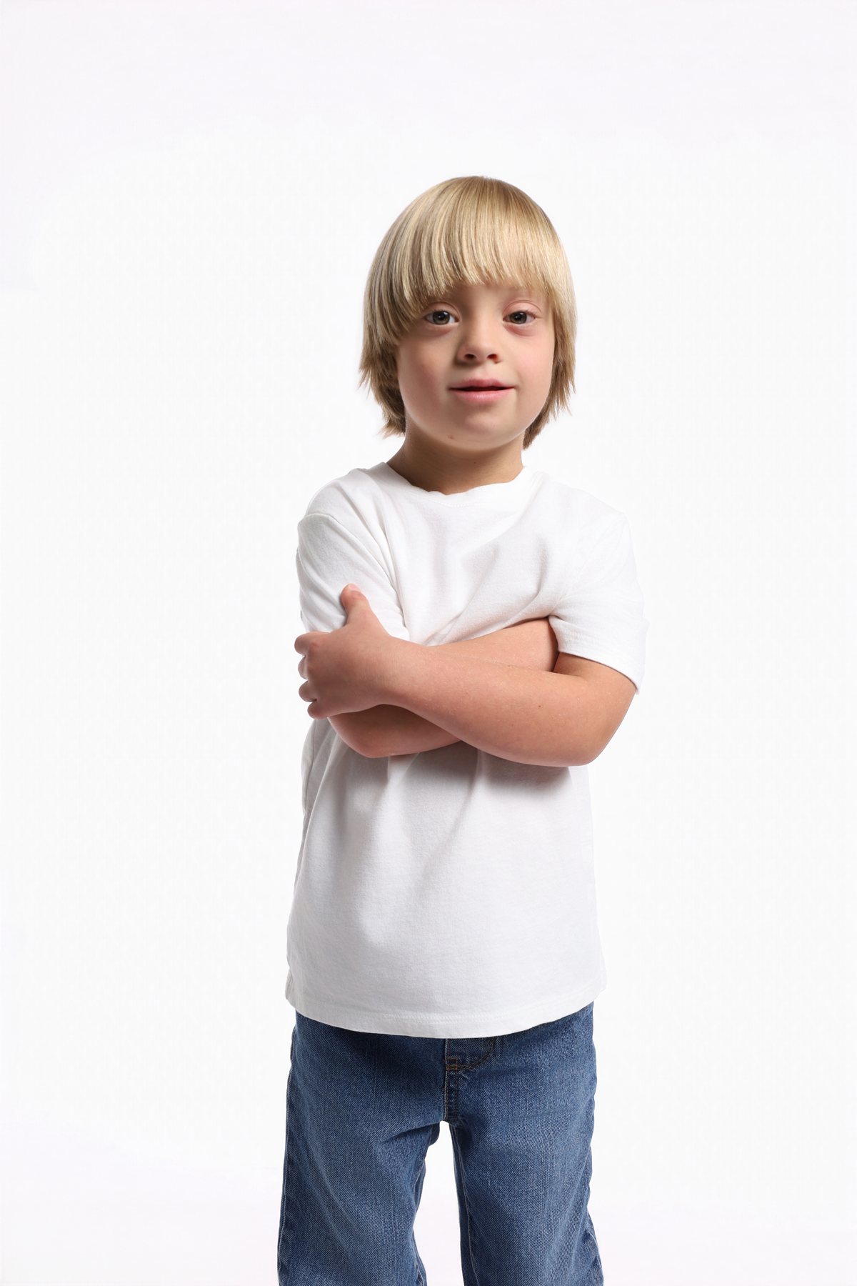 Wesley Wyatt standing with arms crossed in a white tee